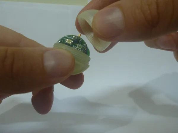 A WiseMote sensor sphere held between two fingers